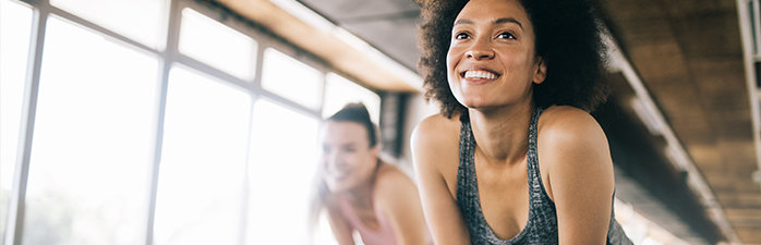 Woman in workout class smiling